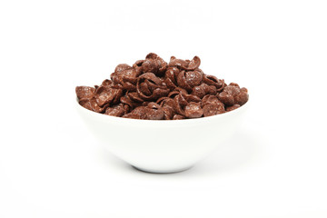 Ceramic plate with chocolate cereal balls isolated on a white background