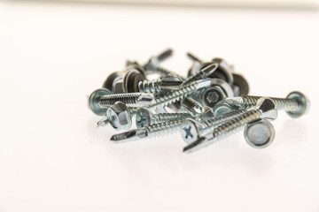 sheet metal and stainless steel screws together with hex nuts