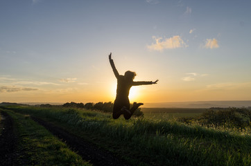 silhouette of a woman jumping