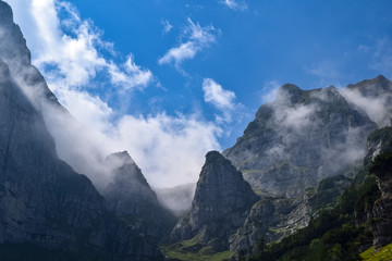 Cloudy mountain peaks of The Dolomites at the Brenta Adamello Mountains, Trentino, Italy