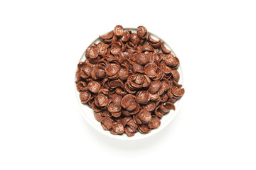 Ceramic plate with chocolate cereal balls isolated on a white background