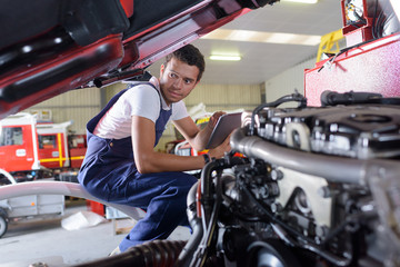 Fototapeta na wymiar mechanic working on engine repairs