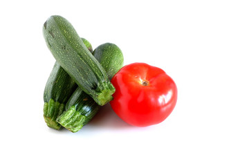 zucchini and tomato on a white background