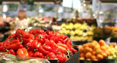 heap of red bell pepper without packaging in supermarket, concept of zero waste and sustainable living