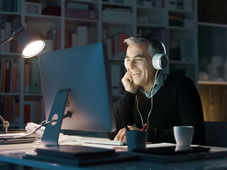 Man watching videos online late at night