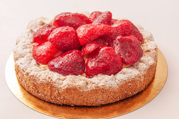 Slice of strawberries tart with yellow pudding