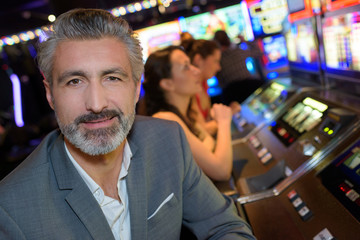 man posing inside the casino