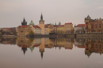 
view of the river and reflections in it. Old Prague architecture by the river Vltava. In the Czech Republic