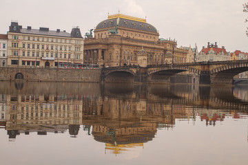 
view of the river and reflections in it. Old Prague architecture by the river Vltava. In the Czech Republic