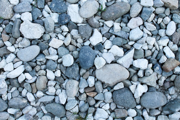 Gray stones lie on the ground. Background for wallpaper. Desktop.