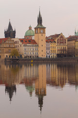 Obraz na płótnie Canvas view of the river and reflections in it. Old Prague architecture by the river Vltava. In the Czech Republic