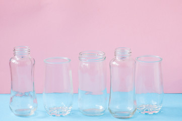 Set of different sizes of transparent mugs or bottles.