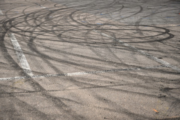 Rubber drift traces inside a driving school polygon practicing zone