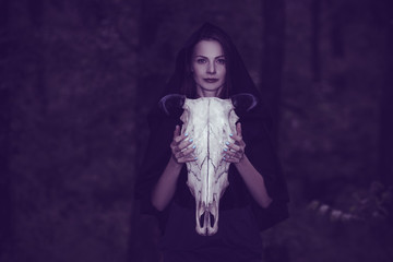 Victim with skull of the animal instead of head. Photo stylized as shooting on an old camera, with...