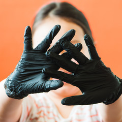 Hands with black gloves background. Close up.