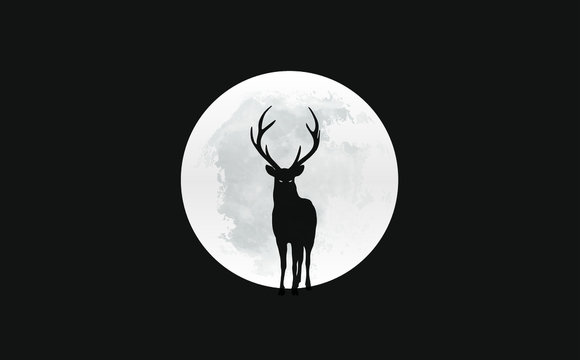 Silhouette of deer in front of the moon
