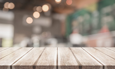 3D Rendering, Wooden top table with bokeh light effect and blur restaurant on background, blur background