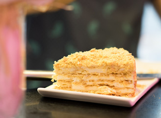 A delicious homemade white layered piece of Napoleon cake, bakery, patisserie, recipe, cooking