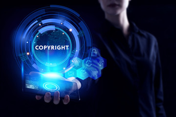 Business, Technology, Internet and network concept. Young businessman working on a virtual screen of the future and sees the inscription: Copyright