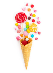 Colorful candy and lollipop in waffle cone