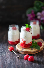 Fermented drink kefir, yogurt in a glass jar on a dark wooden background. Probiotic cold fermented...