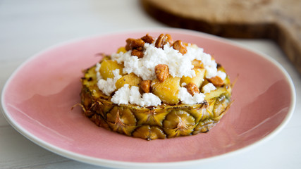 
Pineapple with caramelized peanuts and cheese