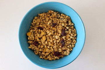 Healthy bowl of muesli, apple, fruit, nuts for a nutritious breakfast of energy for the day