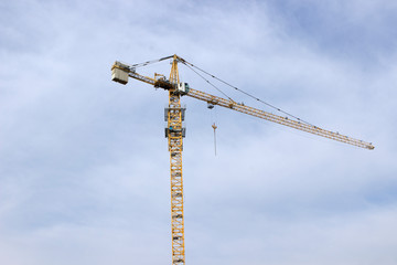 yellow crane against blue sky