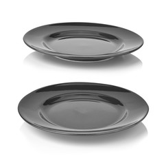 Black empty plate isolated on white background