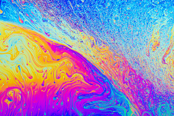 Colorful psychedelic abstract formed by light on the surface of a soap bubble