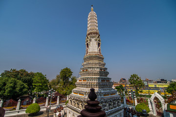 Bangkok, Thailand - January, 2020: The Temple of Dawn, Wat Arun, on the Chao Phraya river and a beautiful blue sky in Bangkok, Thailand. Horizontal with copy space