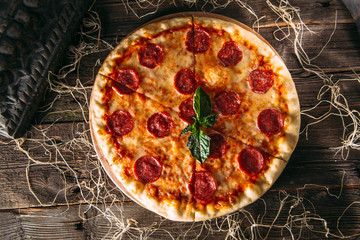Top view on italian pepperoni pizza with salami 