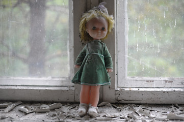 Doll on window in kindergarten in Chernobyl