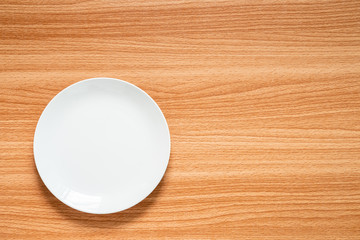 White Dish on Wood Texture Background, Brown and Yellow Color Background Woodgrain Texture.