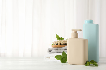 Composition with hair care products on wood table