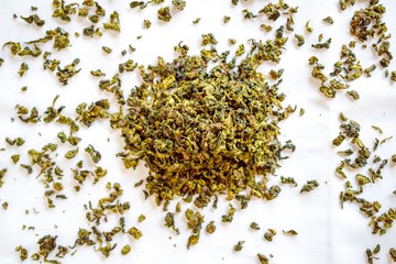 Aromatic green dry tea spread on the table
