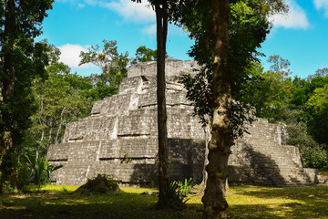 Great ancient mayan pyramid at the jungle of Yaxhá, Guatemala