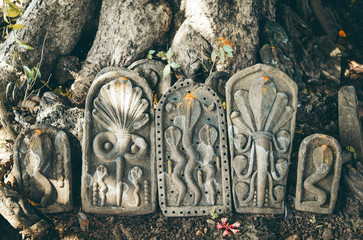 Stones in hindu temple with nagas snakes - obrazy, fototapety, plakaty