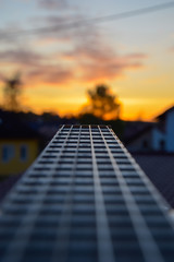 Guitar Close up at sunset 