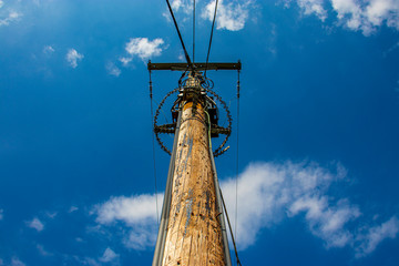 High voltage power lines against blue sky (2).
