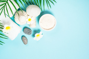 Spa herbal compressing balls on blue background.