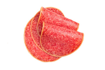 Salami slices isolated on white background.