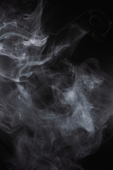 White steam on a black background.