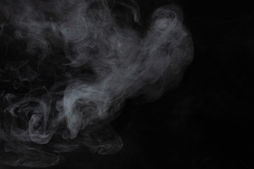 White steam on a black background.