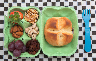 Healthy multisnack in egg carton and bread