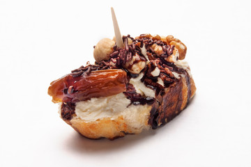  typical spanish food pintxo of cream cheese and nuts