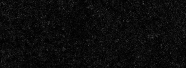 Obraz premium Black background of a texture of cement wall, little stone and concrete - Dark stage background - Large panoramic format