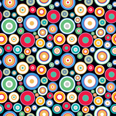 Vector seamless geometric pattern with colorful dots and circles on black background. Modern stylish print