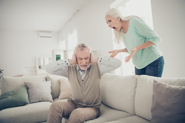 Photo of two sad upset people having great scandal. Angry old lady blaming her husband in betrayal