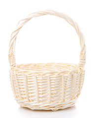 Beige wicker basket made of natural vine. Isolated.